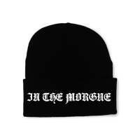 a black beanie with the words'in the mongrel'on it