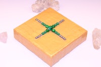 a wooden box with a cross on it
