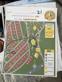 a map of a camping area is on a bed