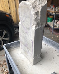 a piece of concrete with a drawing on it