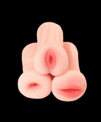 three pink sex toys on a black background