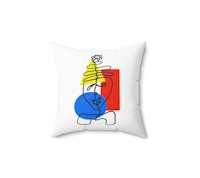 an abstract pillow with a blue, red and yellow design