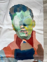 a painting of a man's face on a piece of paper