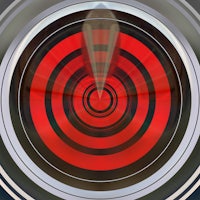 a red and black circle on a black background