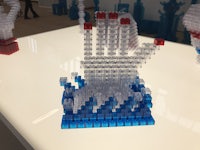 a display of lego sculptures on a table