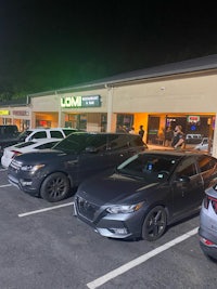 a group of cars parked in front of a restaurant