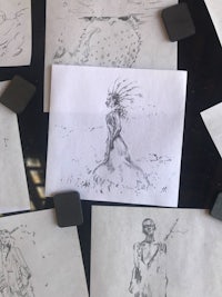a group of drawings on a table