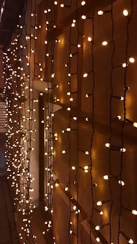 a string of lights on the side of a building
