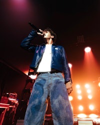a man wearing jeans and a jacket