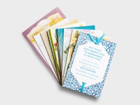 a set of cards with a blue ribbon on them