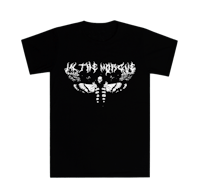 a black t - shirt with an image of a moth on it