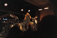 a group of people on stage at a concert