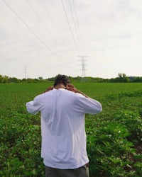 a man standing in the middle of a field