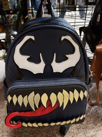 a backpack with a venom face on it