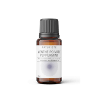 a bottle of peppermint essential oil on a black background