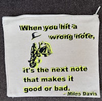 a bag with a quote that says when you hit a wrong note it's the next note that makes it good or bad