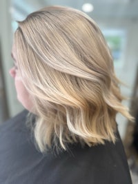 a woman with blonde hair in a salon