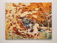a painting of leaves on a wall