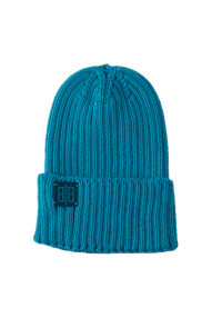 a teal knit beanie on a black background