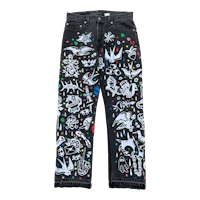 a pair of black jeans with various designs on them