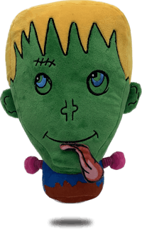 a green and yellow stuffed animal with a tongue sticking out