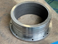 a stainless steel flange with a hole in it