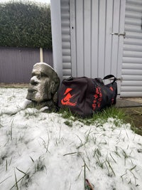 a bag sitting on the ground in the snow