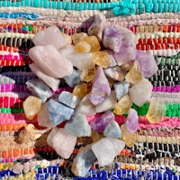 a pile of stones on a colorful rug