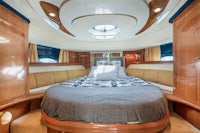 a boat with a bed in the middle of it
