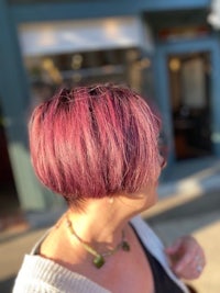 a woman with a burgundy colored bob