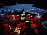 the cockpit of a helicopter at night