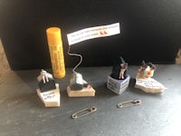 a group of figurines with a message on them