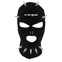 a black mask with spikes on it