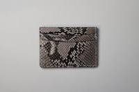 the python skin card holder on a white background
