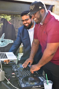 two men at a dj booth
