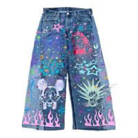 a pair of denim pants with a painted design on them