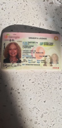 a driver's license with a woman's face on it