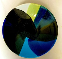 a plate with a blue, green, and yellow design