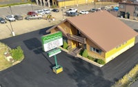 an aerial view of a motel in a parking lot