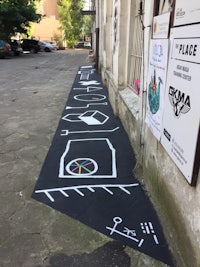 a sidewalk with chalk drawings on it