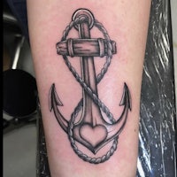 an anchor tattoo with a heart and rope