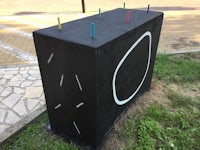 a black box with a circle painted on it