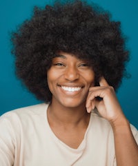 smiling african american woman with afro hair
