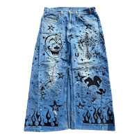 a denim skirt with designs on it