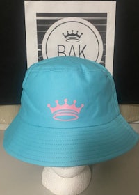 a blue bucket hat with a pink crown on it