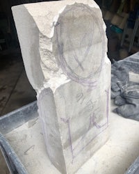 a piece of stone with a drawing on it
