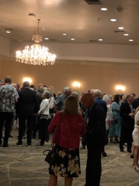 a group of people standing in a room