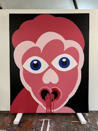 a painting of a pink face with blue eyes