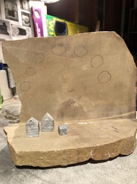 a piece of stone with a drawing on it