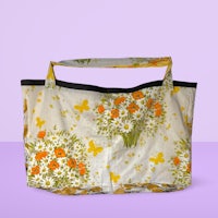 a shopping bag with flowers on it